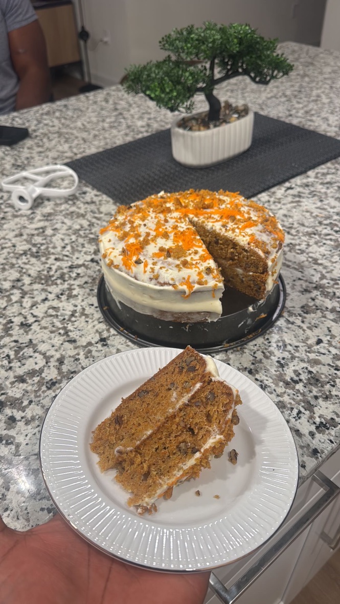 Freshly sliced carrot cake with frosting
