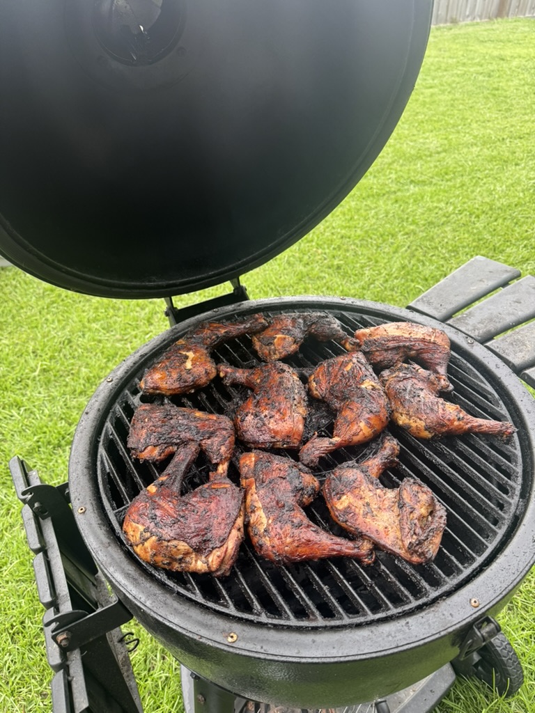 Seasoned chicken cooking on the grill