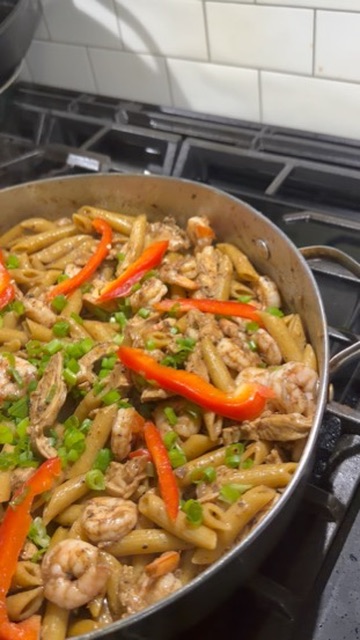 Pasta with shrimp, chicken, and colorful peppers